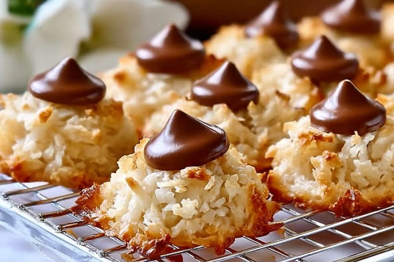 Delicious Coconut Macaroon Blossoms stacked on a plate.