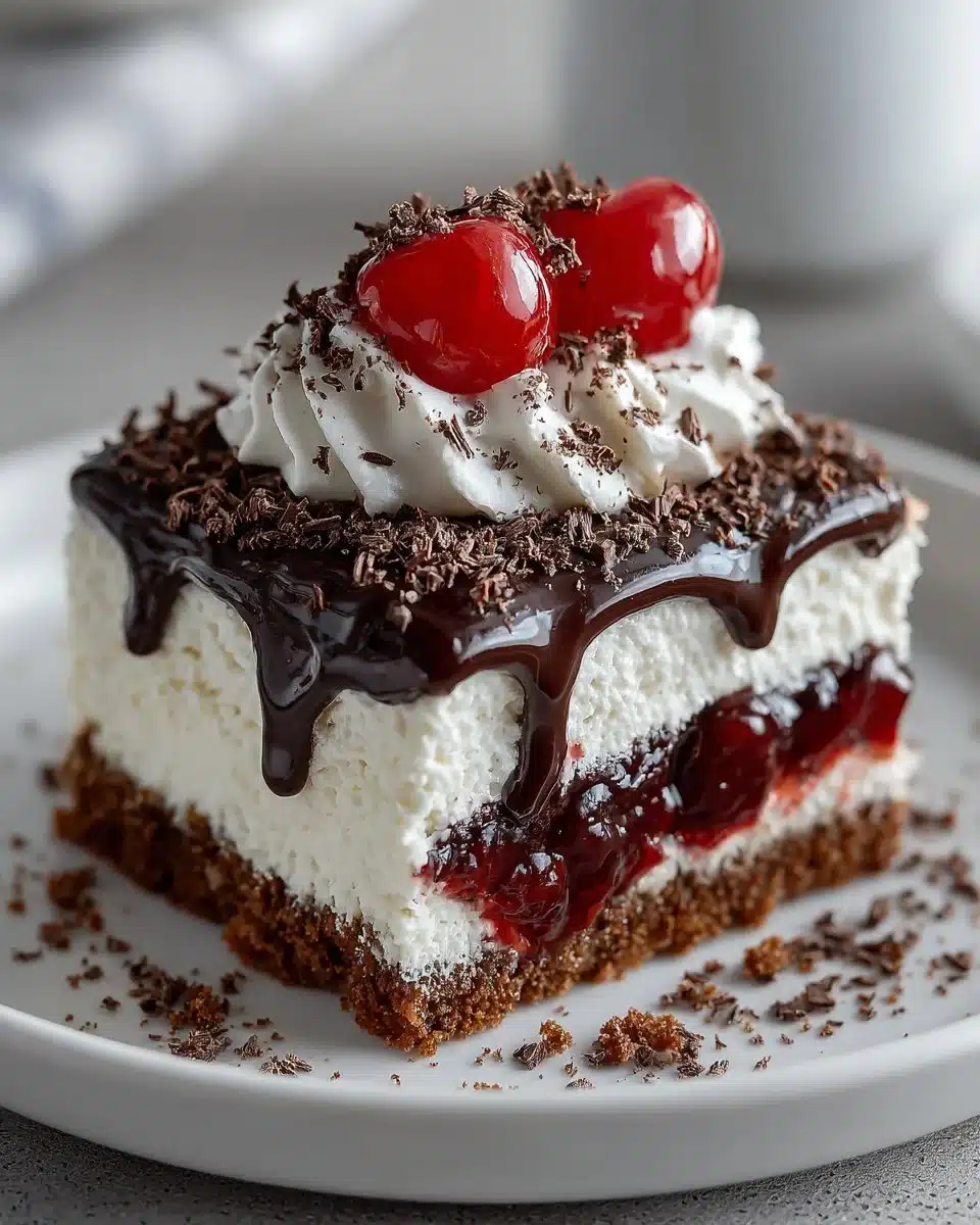 Delicious chocolate cherry lush dessert with chocolate and cherries layers.
