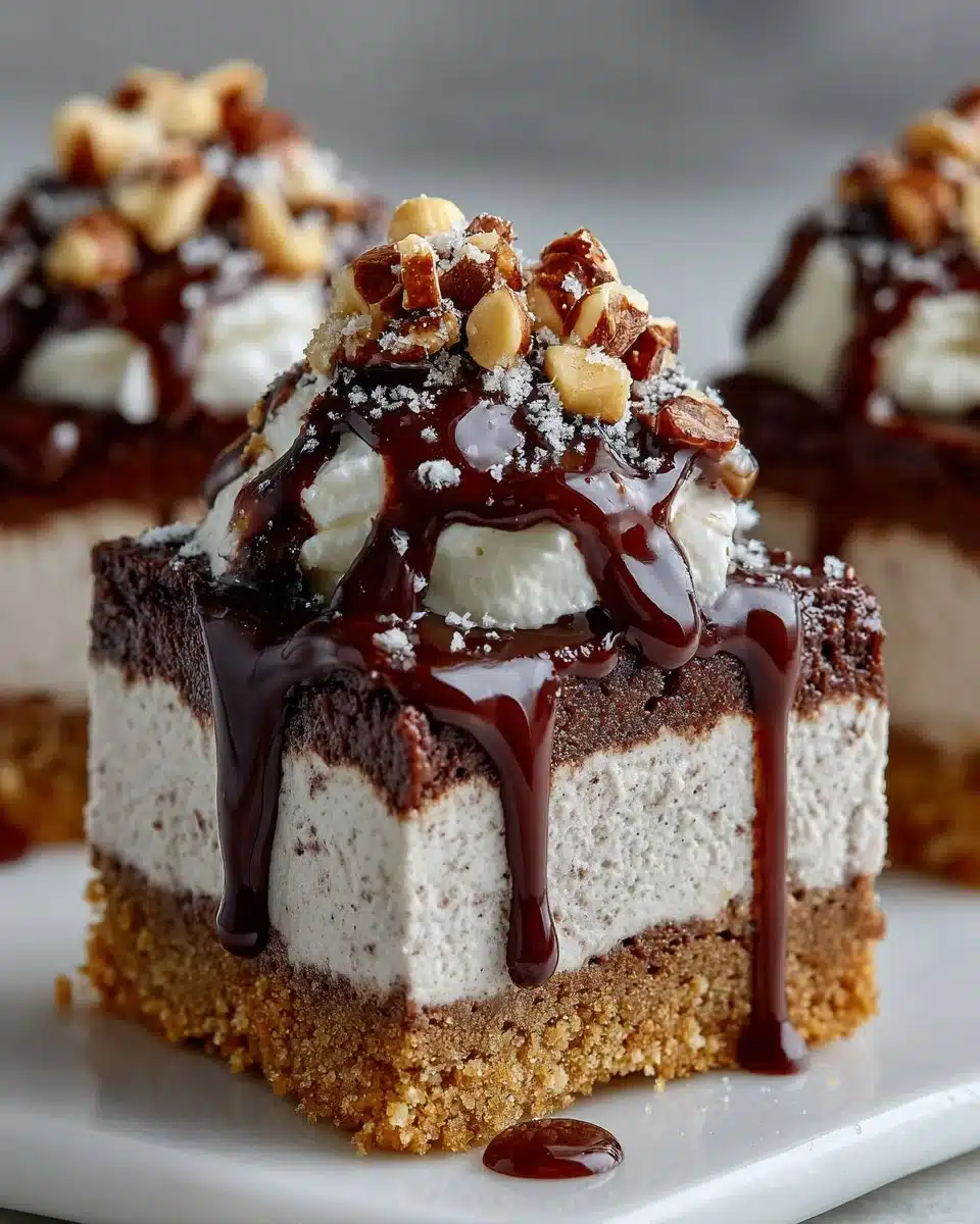 Delicious Chocolate Hazelnut Cheesecake Bars served on a plate with chocolate drizzle