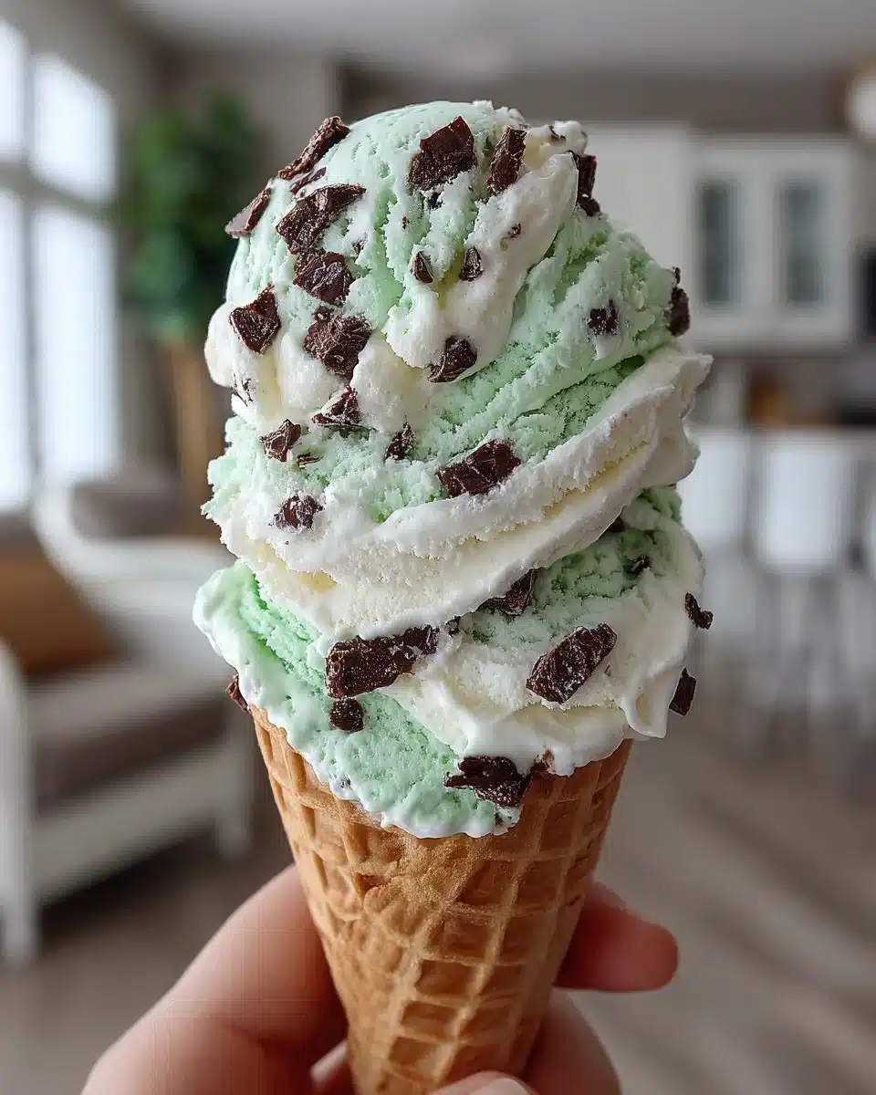 Delicious bowl of mint chocolate chip ice cream topped with chocolate flakes