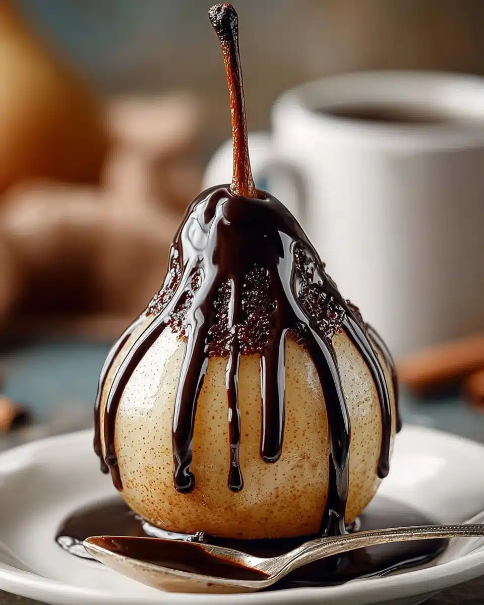 Delicious poached pears served with rich chocolate sauce on a plate