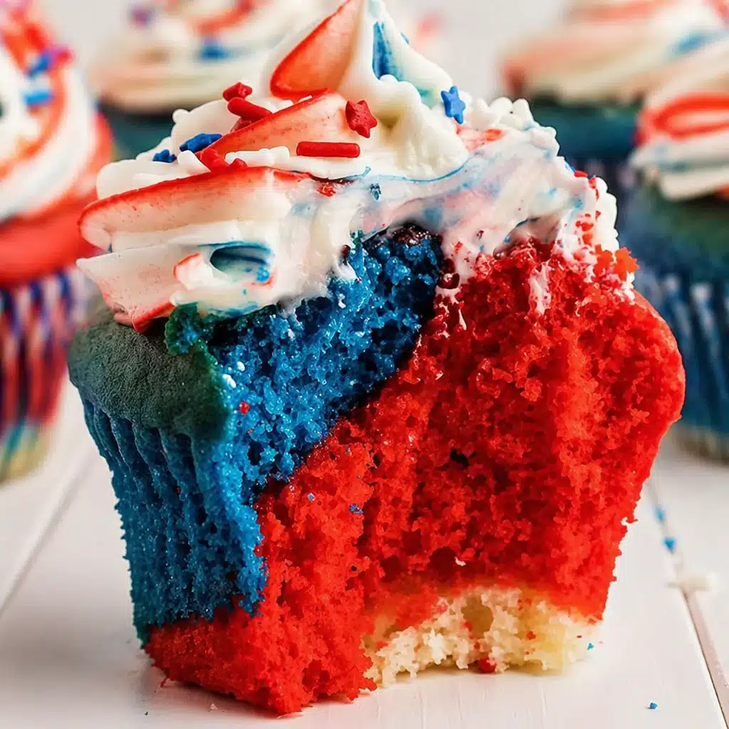 Delicious 4th of July Red White and Blue Cupcakes decorated with berries.