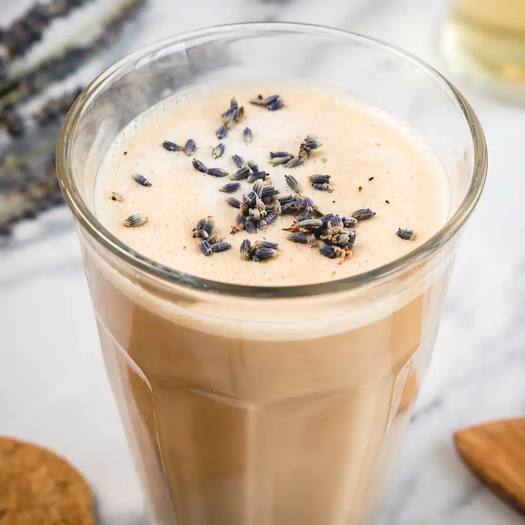 Refreshing homemade iced vanilla latte mocktail with creamy foam and vanilla syrup