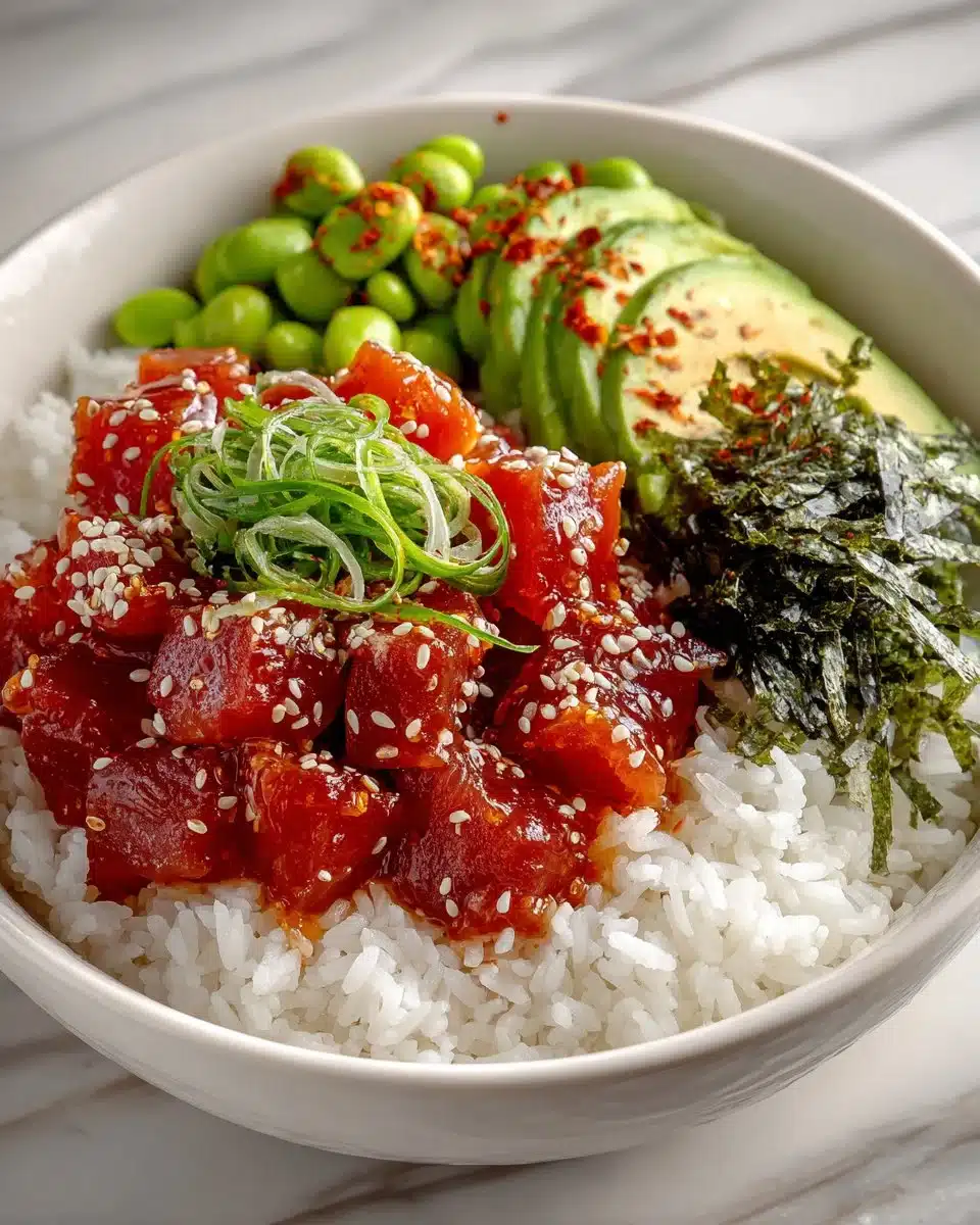 Spicy tuna poke bowl with edamame and fresh toppings