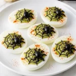 creepy spider web deviled egg halloween snack for 2026 07 11 153128 683x1024 1