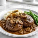 homestyle salisbury steak with rich mushroom gravy 2026 07 22 031501 683x1024 1