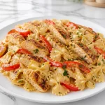 creamy cajun chicken alfredo bowtie 2026 08 06 141325 683x1024 1