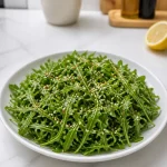 peppery arugula gochugaru lemon salad 2026 08 18 203853 683x1024 1